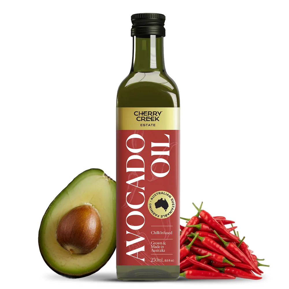 Cherry Creek Estate Chilli Infused Avocado Oil bottle with fresh chillies