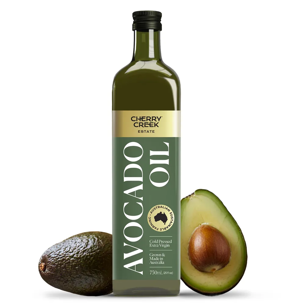 Cherry Creek Estate Extra Virgin Avocado Oil bottle with fresh avocados
