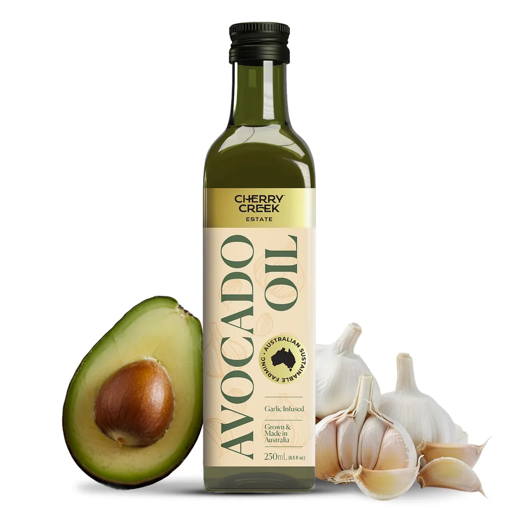 Cherry Creek Estate Garlic Infused Avocado Oil bottle with fresh garlic