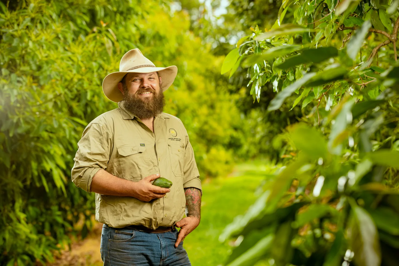 The Cherry Creek Estate farmer standing among the orchard rows